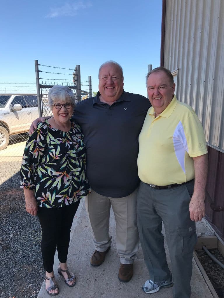 Ernie with family outside the shop
